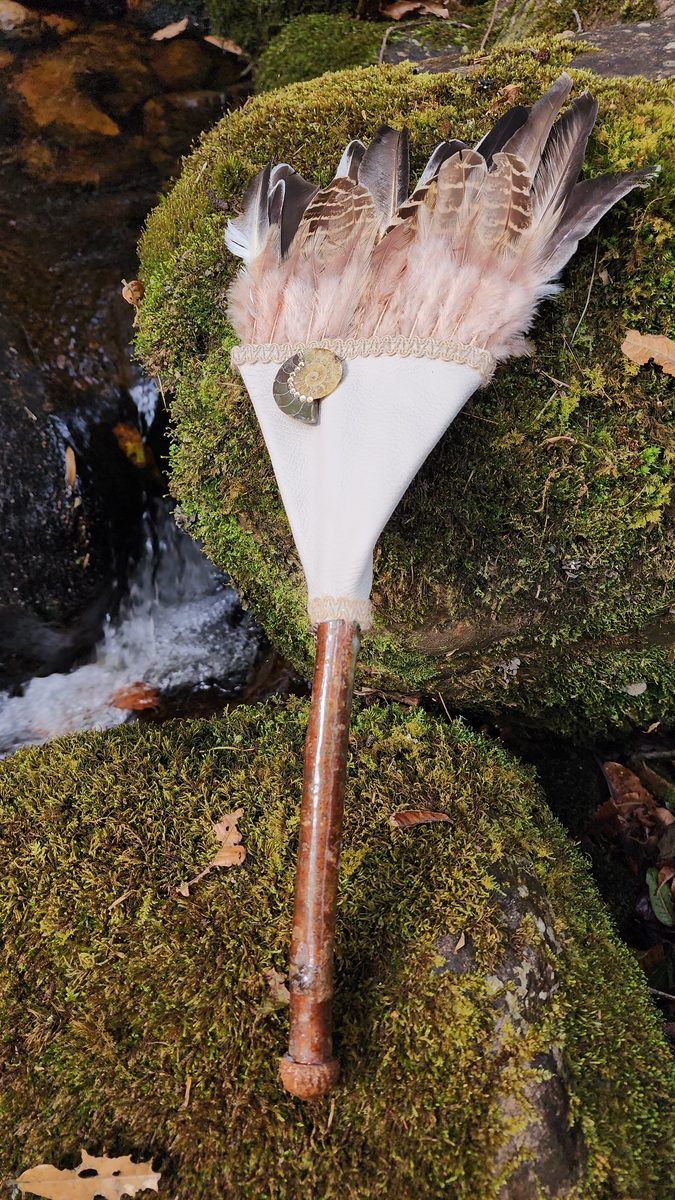 Feather fan wand on moss